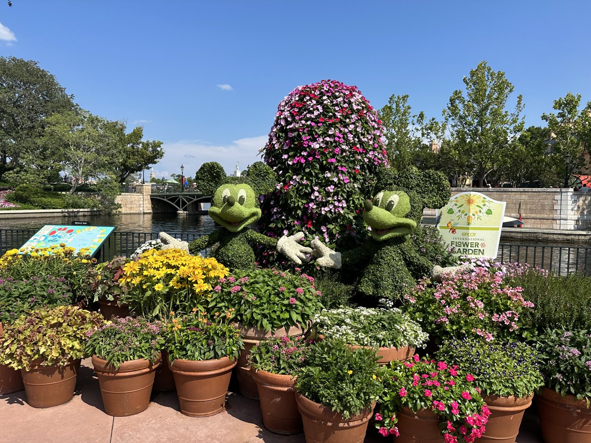 Character topiaries surrounded by flowers